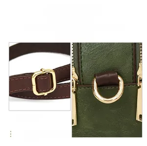 Detail of dark green lychee grain leather and shiny gold hardware on a crossbody bag