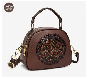 Macro shot of brown faux leather texture and retro round embossed pattern on the handbag