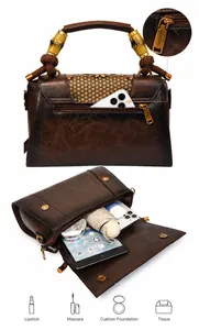 Detail of vintage tote bag featuring bamboo handle and large capacity storage compartments