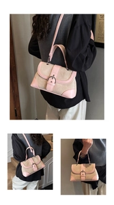 Detail view of pink leather and beige canvas patchwork handbag with metallic pin buckle closure