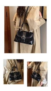 Detail view of retro patchwork shoulder bag with contrast stitching and silver buckle