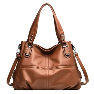 Vintage caramel litchi grain leather tote bag with crossbody strap and cross stitch detail