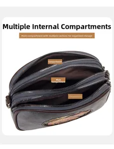 Détail des compartiments à fermeture éclair d'un sac bandoulière vintage de style ethnique