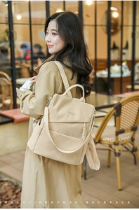 Detail of beige corduroy multi-purpose backpack with adjustable straps on female model