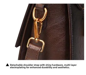Detail of vintage tote bag with detachable strap and gold-plated hardware clips