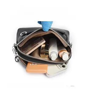 Internal view of double zipper shell bag showing large storage capacity for cosmetics