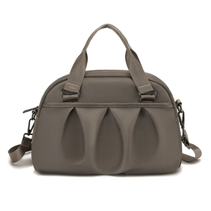 Neutral grey nylon tote bag with large front pleats and adjustable crossbody strap
