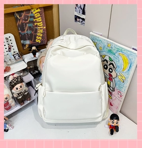 Close-up of white PU leather backpack with gothic GHE embroidery and side pockets