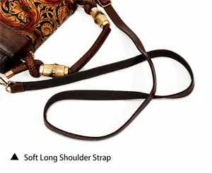 Detailed close-up of retro carved leather bag with bamboo style metal buckle and woven strap
