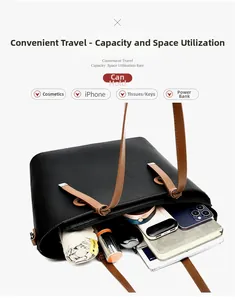 Détail de l'espace intérieur d'un cabas noir en cuir montrant une grande capacité