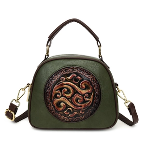 Retro shoulder bag with Chinese cloud pattern embossing and contrast top handles