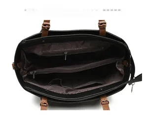 Structure interne du grand sac cabas avec compartiments multiples et doublure marron