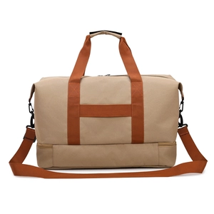 Large khaki travel bag with separate shoe compartment and reinforced orange straps