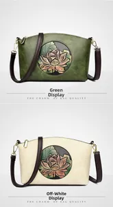 Close-up of embossed lotus pattern on vintage green and beige leather crossbody bags