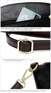 Detail of dark brown leather bag with golden hardware, adjustable strap and back zipper