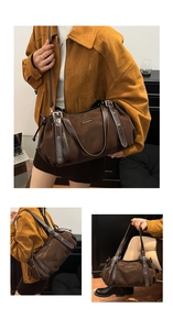 Detail view of large dark brown tote bag with metal buckles and branding on shoulder strap
