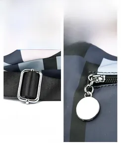 Close-up of shiny silver metal zipper and buckle on a geometric nylon backpack