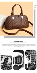 Detailed silver-tone hardware of brown woven PU handbag with dual zippers and hooks
