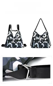 Detailed view of the nylon backpack with geometric prints and silver hardware clips