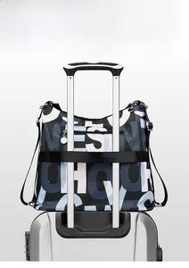 Rear view of travel bag showing luggage sleeve attached to a suitcase handle
