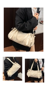 Detail view of large beige PU leather tote bag with side drawstring and Suvona logo