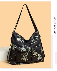 Detail of waterproof nylon shoulder bag with bamboo leaf pattern and multiple zip pockets