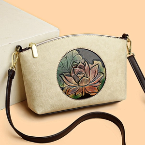 Vintage lotus embossed beige leather crossbody bag with brown straps and gold hardware