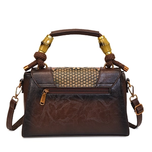 Vintage dark brown leather handbag with bamboo handle and adjustable shoulder strap