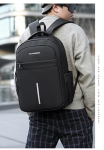 Close-up of waterproof business backpack featuring silver reflective strip and logo detail