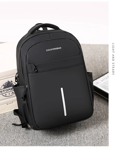 Detail view of black waterproof backpack featuring reflective stripe and brand logo