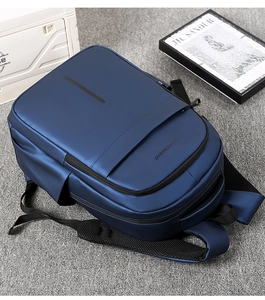Close-up of waterproof dark blue travel backpack with matte finish and padded straps