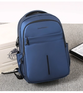 Detail of waterproof matte fabric and front pocket on the navy blue business backpack