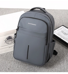 Detail view of large gray waterproof backpack with ZHUIFENGBAO logo and matte texture