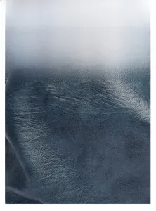 Detail of dark blue leather texture showing wear-resistant and waterproof surface features