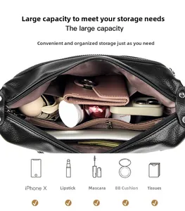 Interior view of black litchi leather bag showing large capacity and multi-pocket storage