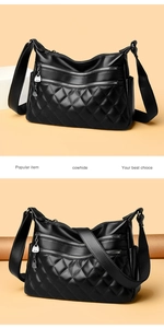 Detail of black quilted cowhide leather shoulder bag with multi-layer metal zippers