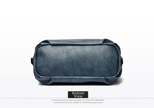 Detailed bottom view of the navy blue textured leather handbag with side rivet details