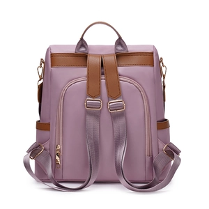 Damen Rucksack aus violettem Oxford-Stoff mit braunem Lederbesatz und goldenen Zippern