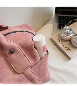 Macro view of side pocket on pink matte tote bag holding personal care product