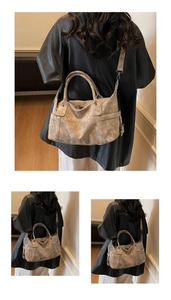 Detail view of a gray vintage tote bag featuring detachable metal buckles and top handles