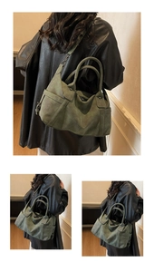 Close-up of retro green tote bag showing matte leather texture and decorative stitching