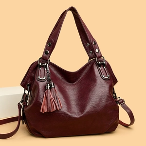 Deep wine red large tote bag with tassel charm and adjustable shoulder strap