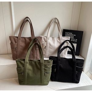 Vertical corduroy tote bags with zipper pockets in brown, white, green and black colors
