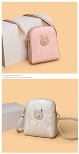 Detail of pink and beige crossbody bags with snake pattern texture and double zippers