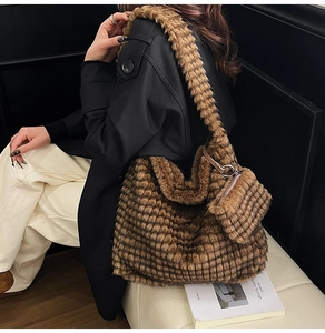 Detail of a brown plush tote bag with a textured grid pattern and a matching small pouch