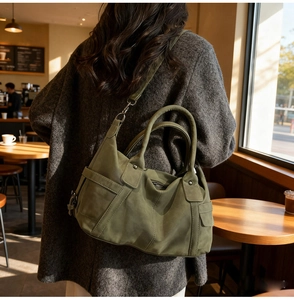 Olive green tote bag in suede texture showing back view with adjustable shoulder strap