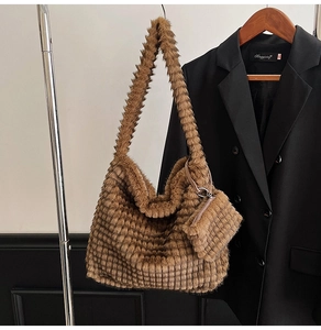 Detail of brown plush tote bag with grain faux fur texture and matching coin pouch