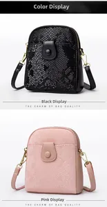 Close-up of dual-zipper crossbody bags in black and pink with snakeskin texture