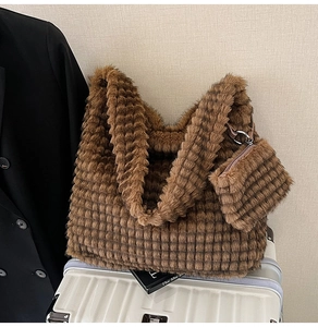 Detail of plush brown cloud tote with square quilted texture and matching coin purse