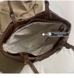 Internal view of large tote bag with herringbone lining and zippered pocket